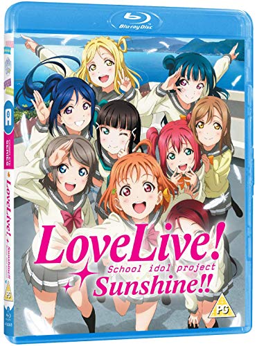 Blu-ray case featuring nine smiling anime girls with bright colors.
