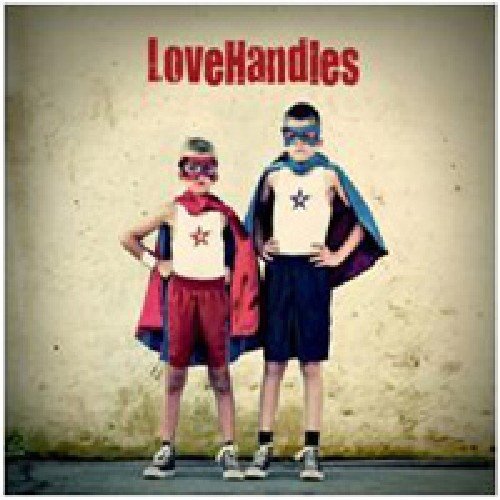 CD cover: two young boys dressed as superheroes pose confidently.