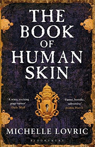 Dark book cover with ornate gold details and title "The Book of Human Skin".