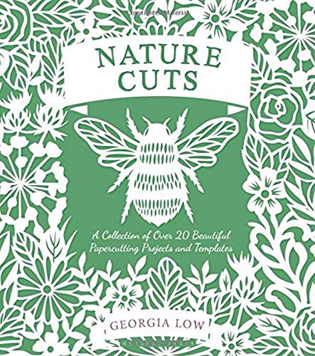Green book cover with white papercut floral and insect designs.