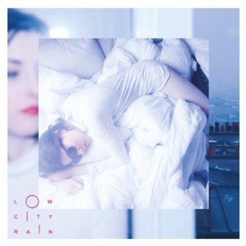 CD cover: person in bed, blue tones, text “Low City Rain.”