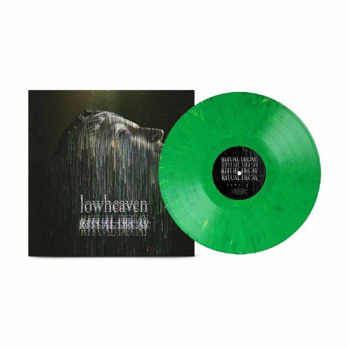 Green vinyl record and album cover with a distorted face illustration.