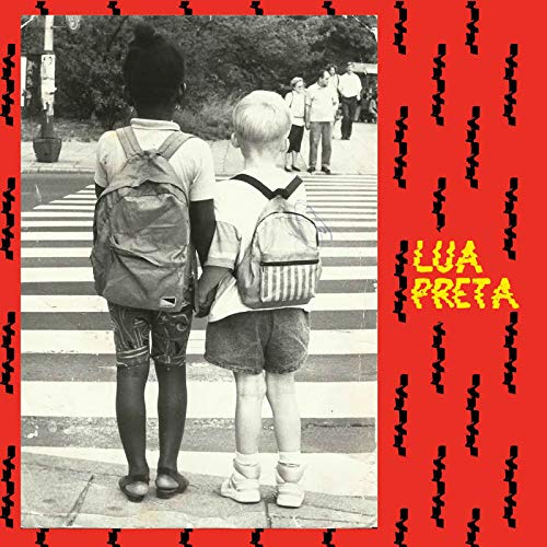 Two children with backpacks stand on a crosswalk, framed by a red border.