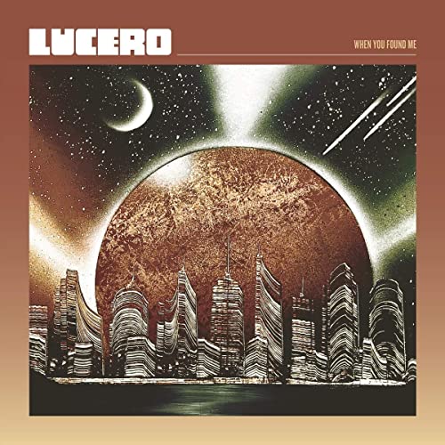 Lucero album cover: cityscape under a planet and crescent moon.