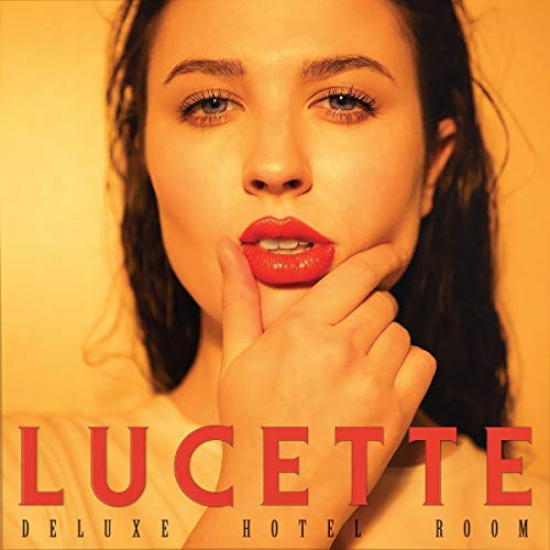 Close-up portrait of Lucette with album title “Deluxe Hotel Room.”