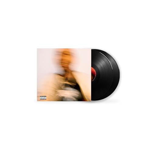 Vinyl record with blurred album art of a person in light clothing.
