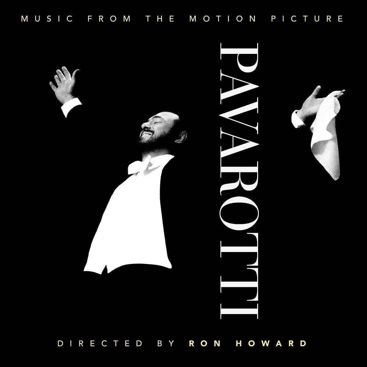 Black-and-white image of Pavarotti in tuxedo, arms raised, with text "Pavarotti" and credits.