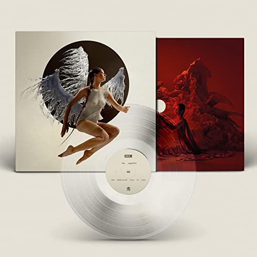 Vinyl record with album cover featuring a woman with wings.