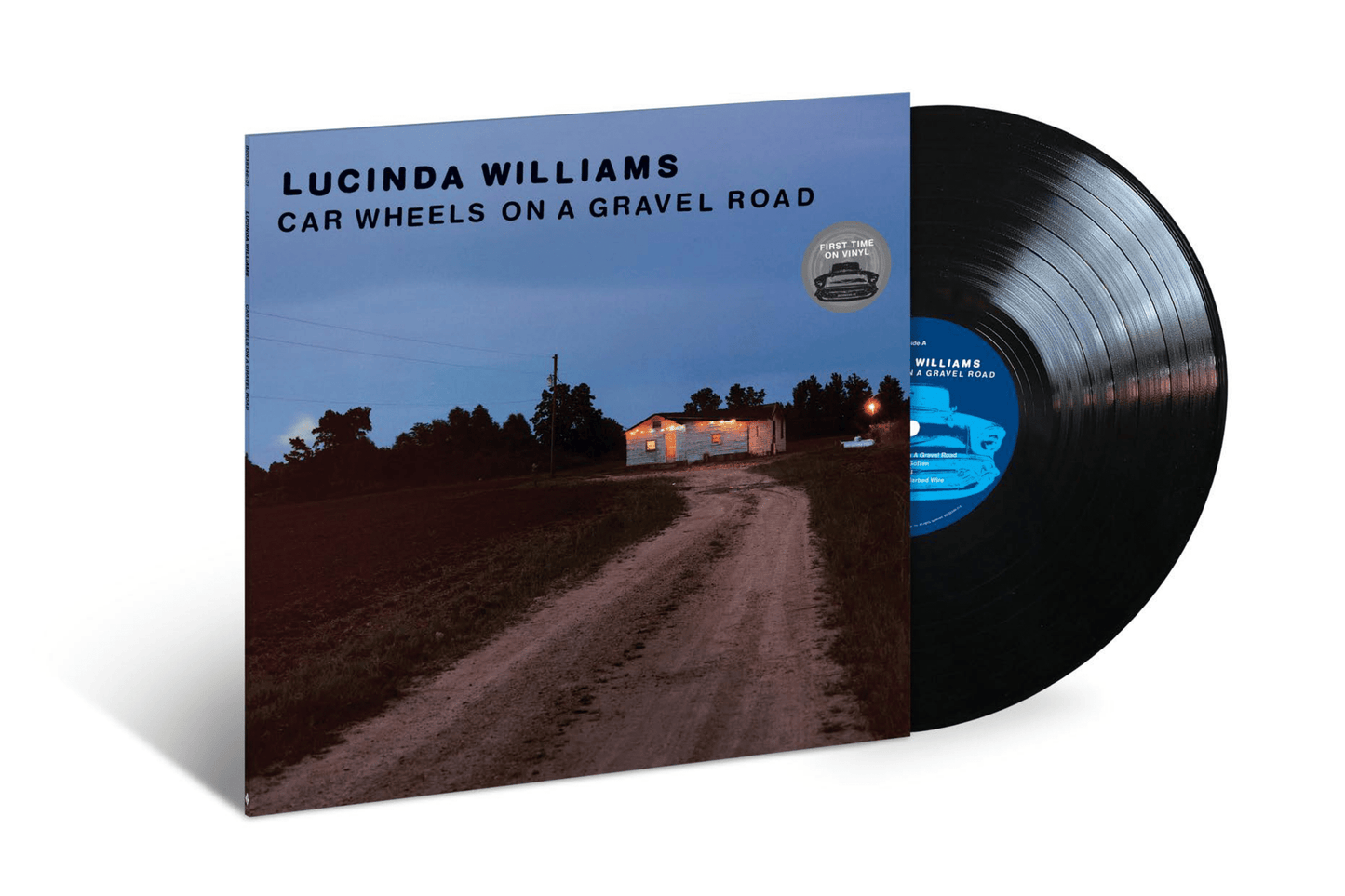Lucinda Williams album cover and black vinyl record against white background.