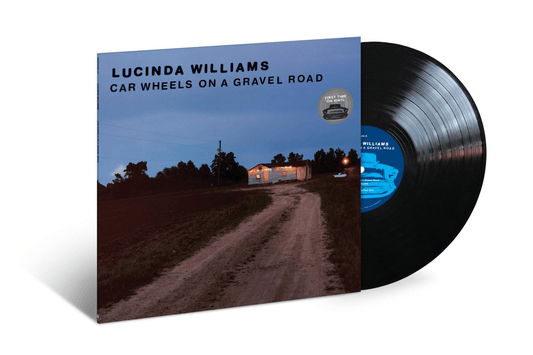 Lucinda Williams album cover and black vinyl record against white background.
