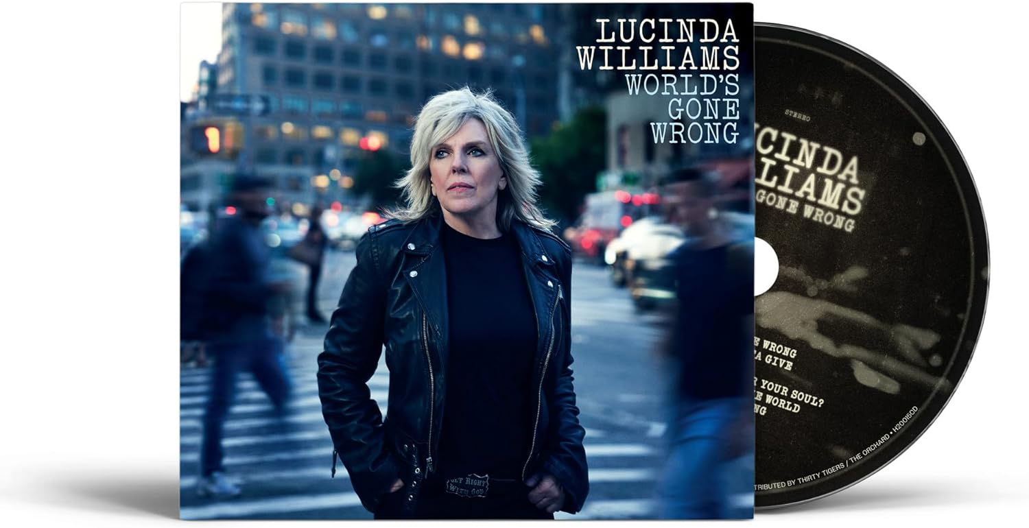 Lucinda Williams album cover: woman in leather jacket, city background, CD.
