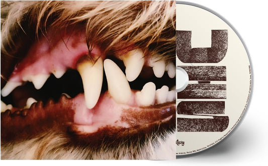 CD case with a close-up of a dog's face and large white lettering.