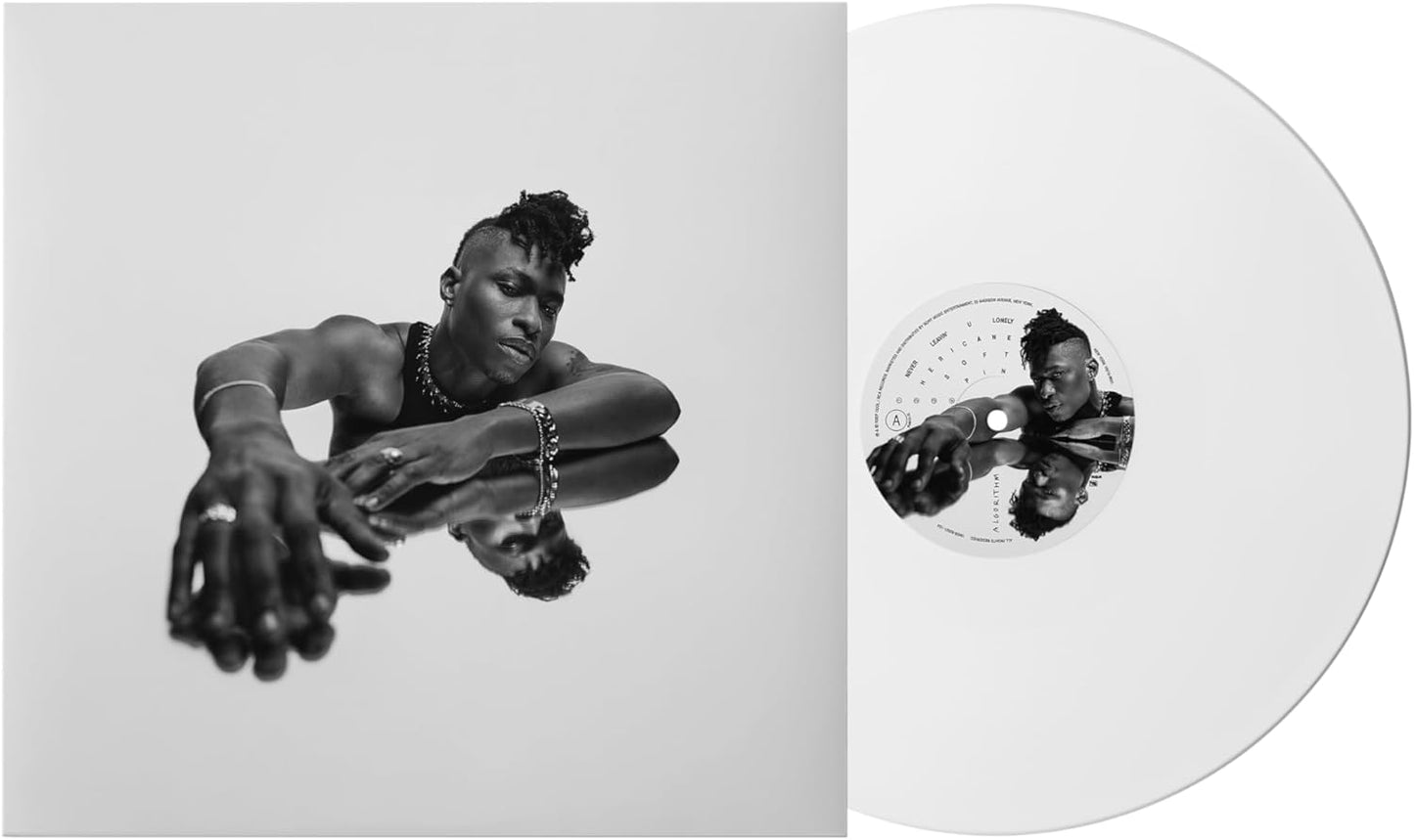 Lucky Daye's "Algorithm" vinyl record, featuring a portrait and white disc.