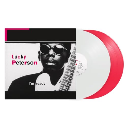 Vinyl record of Lucky Peterson with red swirl and portrait cover.