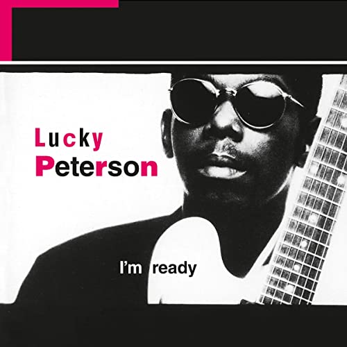 Black and white album cover featuring Lucky Peterson wearing sunglasses and holding a guitar.