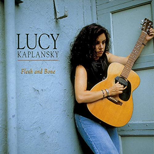 Lucy Kaplansky album cover, showing artist with acoustic guitar leaning on wall.