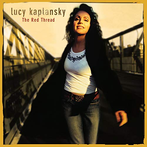 CD cover featuring Lucy Kaplansky on a bridge, looking upwards.