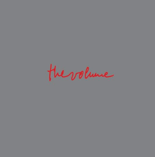 Gray background with red, handwritten-style text reading "the volume".