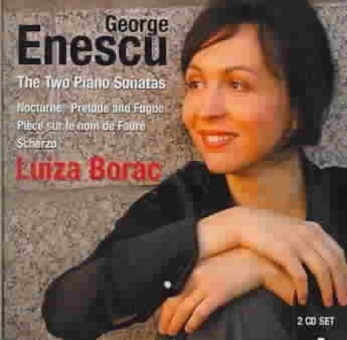 CD cover featuring a smiling woman with dark hair against a speckled stone background.