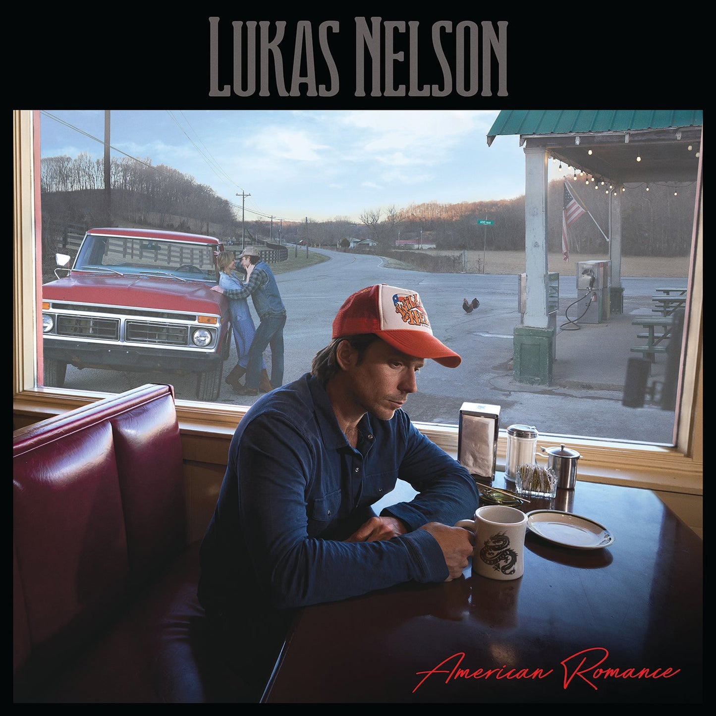 Lukas Nelson album cover: man in diner, rural scene visible through window.