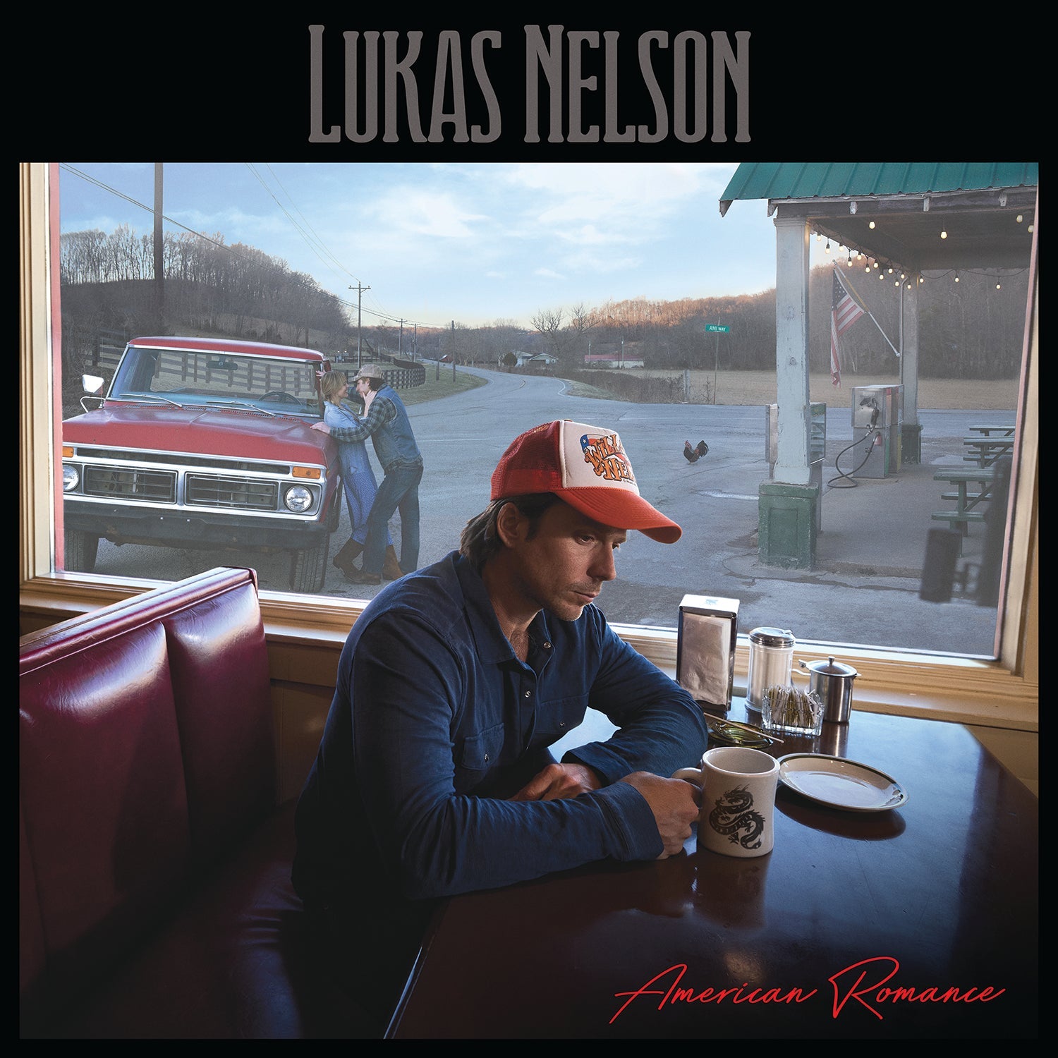 Lukas Nelson album cover: man in diner, rural scene visible through window.