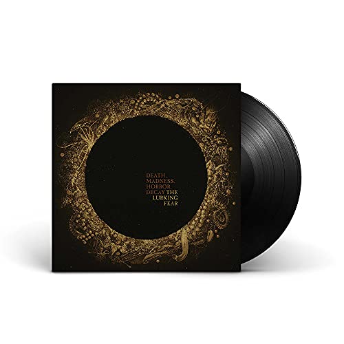 Vinyl record with ornate gold design on a dark album cover.