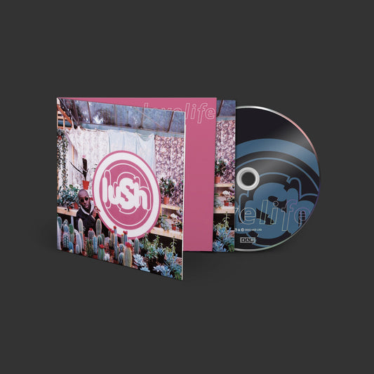 Lush “Lovelife” CD case and disc with pink and greenhouse imagery.