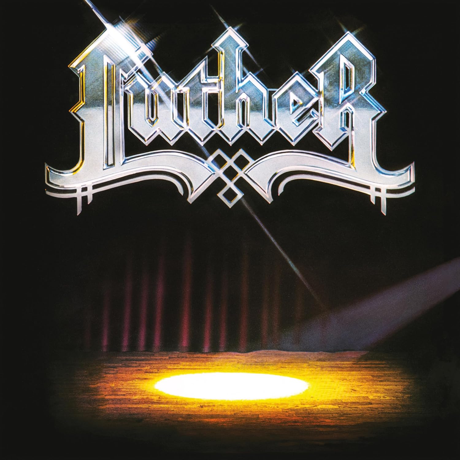 Luther album cover with ornate silver logo over a dark, glowing landscape.
