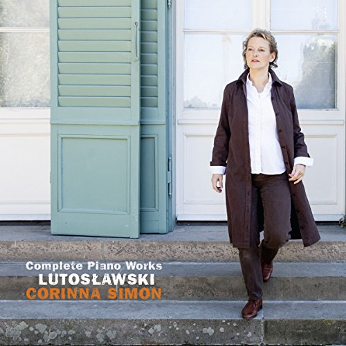 "CD cover with a woman standing on steps in front of a building."