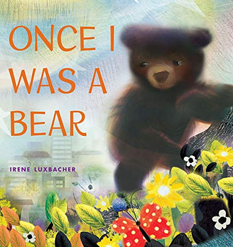 Book cover: a dark bear cub amidst flowers and a distant town.