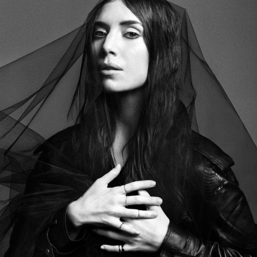 Black and white portrait of Lykke Li with sheer fabric draped over her.
