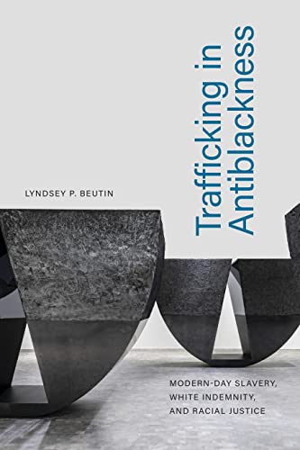 Book cover with abstract stone sculpture and blue text: "Trafficking in Antiblackness.