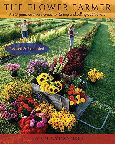 Book cover featuring a flower-filled wheelbarrow in a field.