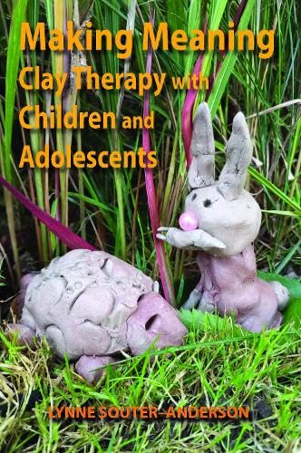 Book cover featuring clay animal sculptures in tall grass.