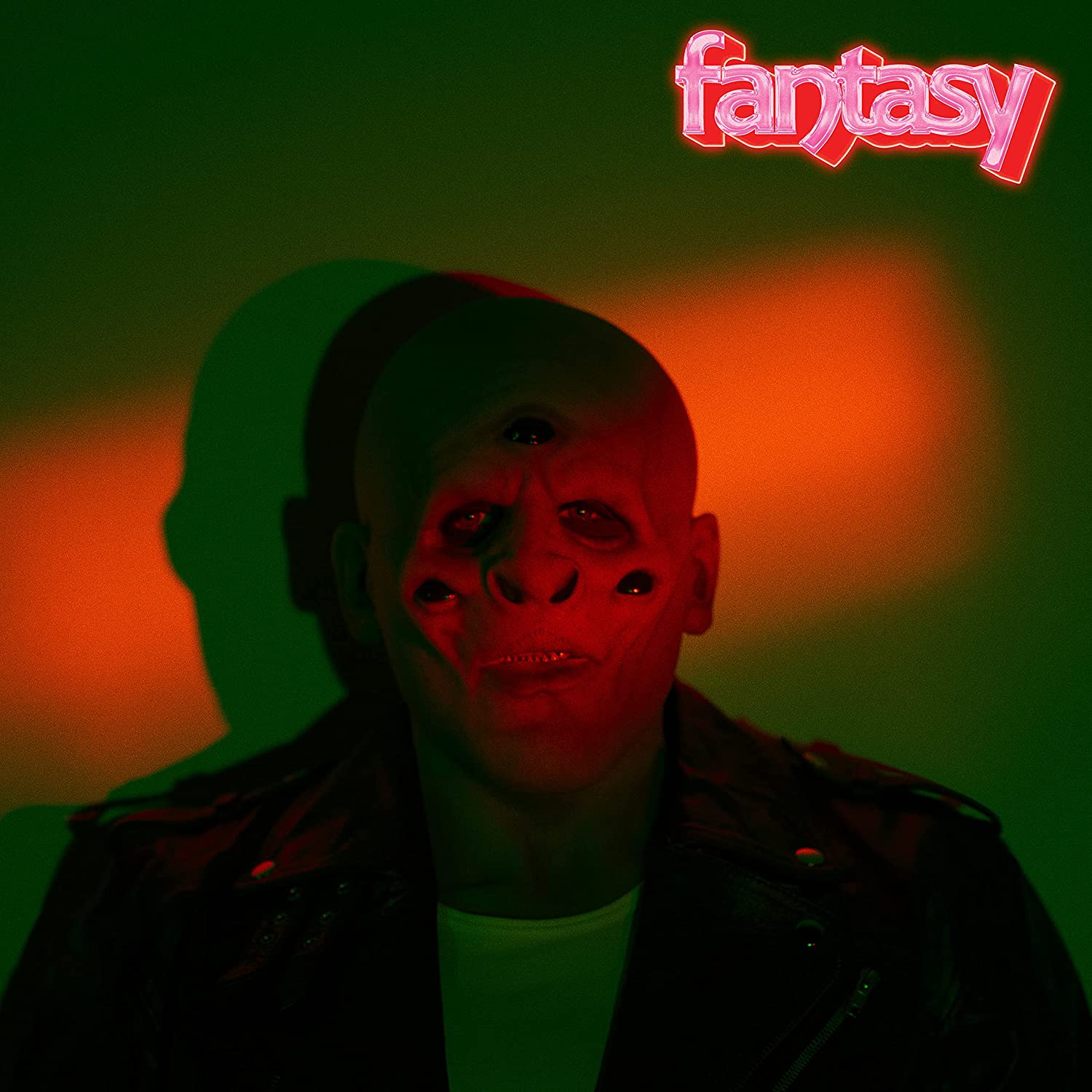 M83 "Fantasy" CD cover: red and green portrait of a man’s face.