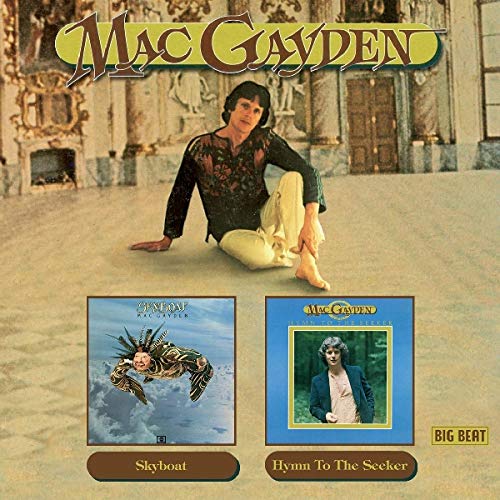 Mac Gayden sitting in a ballroom with two album covers below him.