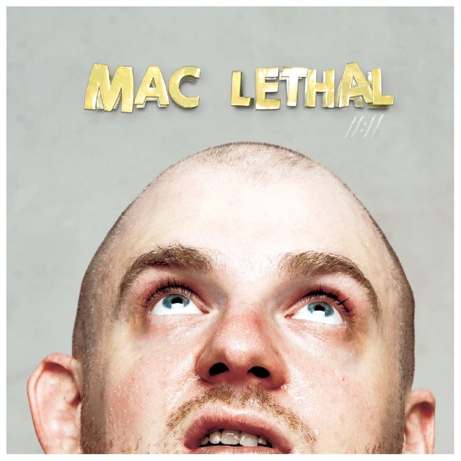 CD cover for Mac Lethal’s “11:11” featuring a close-up portrait.