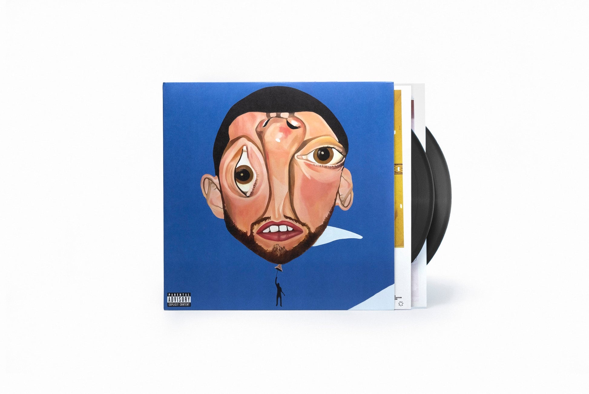 Mac Miller's "Balloonerism" vinyl album cover with two black records beside it.