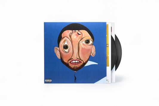 Mac Miller's "Balloonerism" vinyl album cover with two black records beside it.