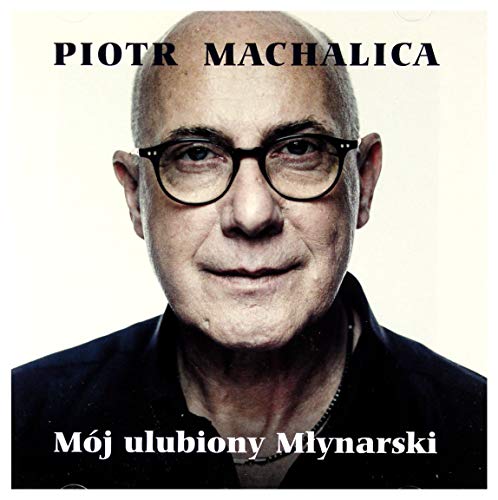 Close-up portrait of Piotr Machalica with glasses, album cover art.