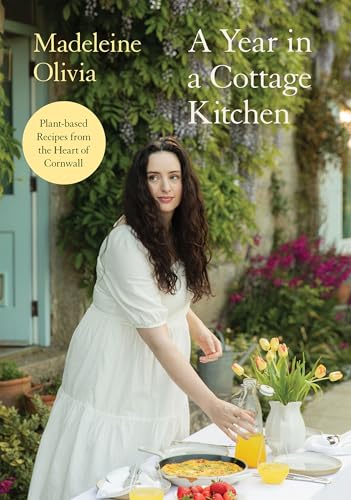 Cookbook cover featuring author Madeleine Olivia with food and flowers.