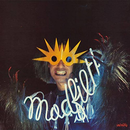 A person wearing a yellow star-shaped mask, with "Madfilth" written across their chest.