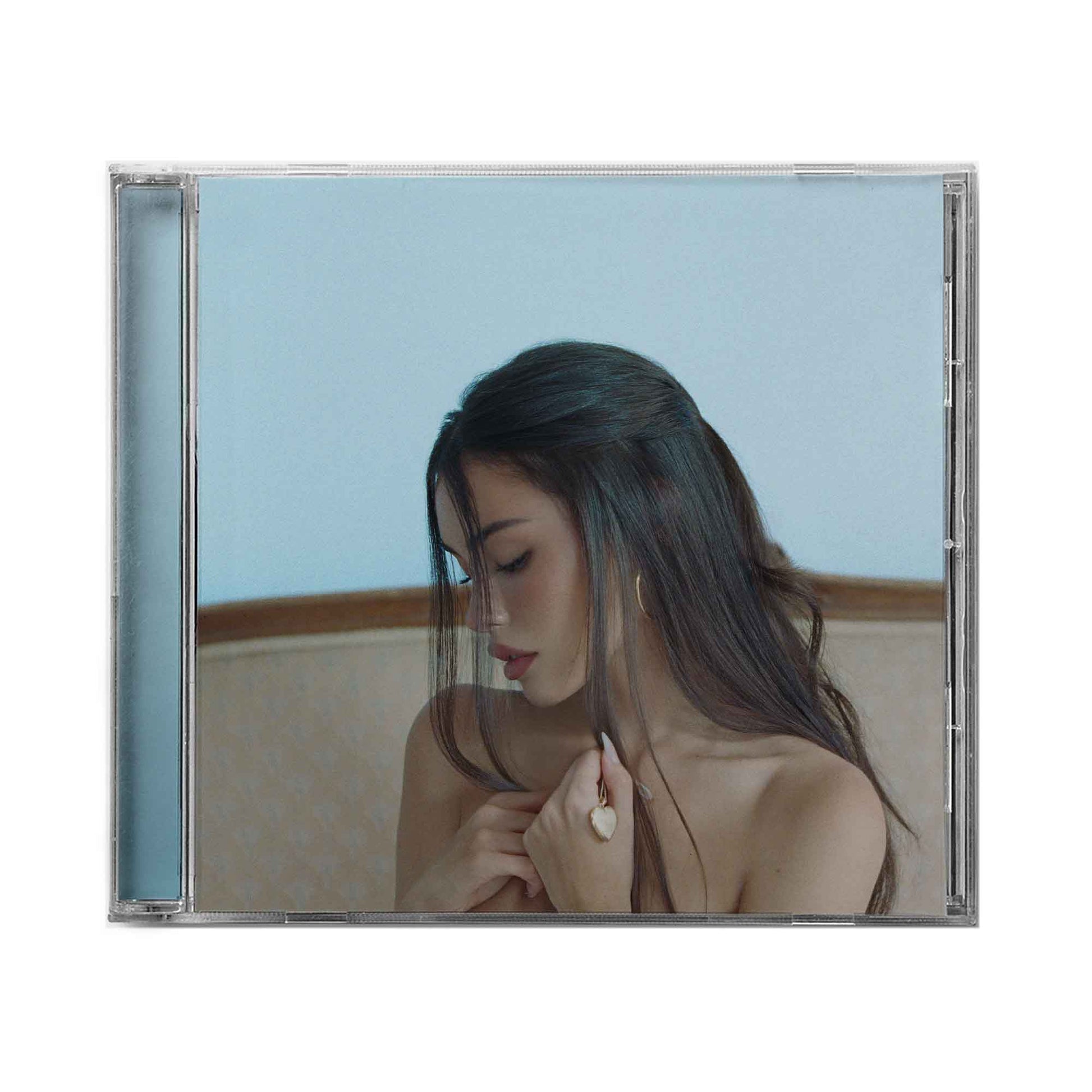 CD case featuring Madison Beer with long dark hair, looking downward.