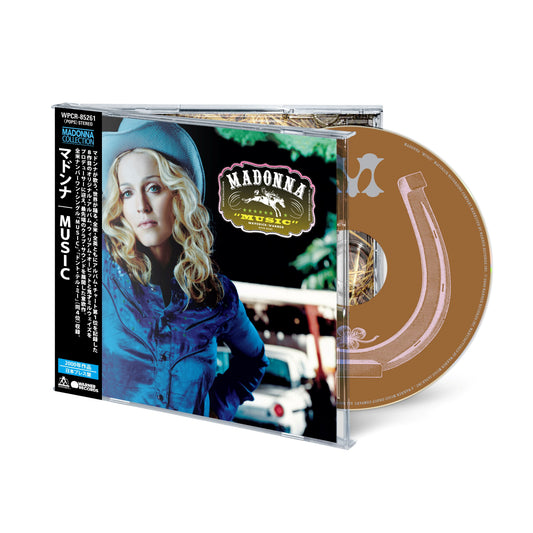Madonna’s “Music” CD case with a portrait and pink guitar design.