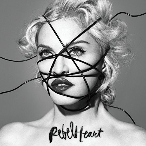Black and white portrait of Madonna with lines obscuring her face.