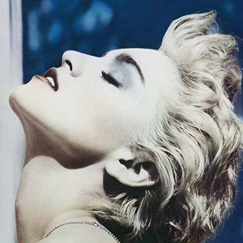 "Madonna vinyl album cover featuring a close-up of Madonna's face with short blonde hair."