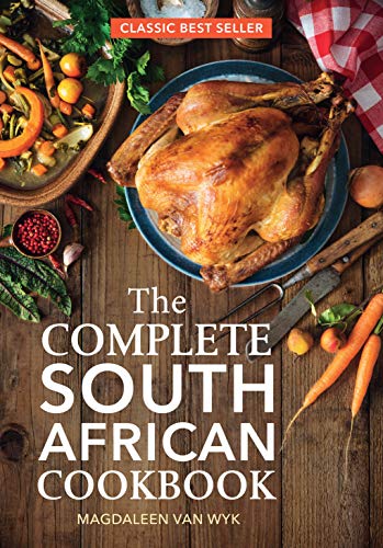 Cookbook cover featuring roasted chicken and vegetables on wood.