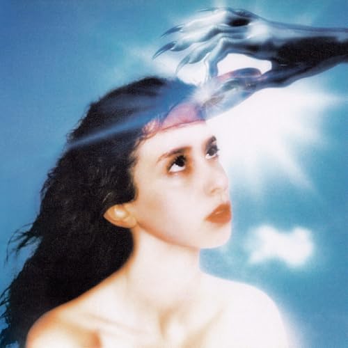 A clawed hand touches a woman's forehead against a blue sky background.