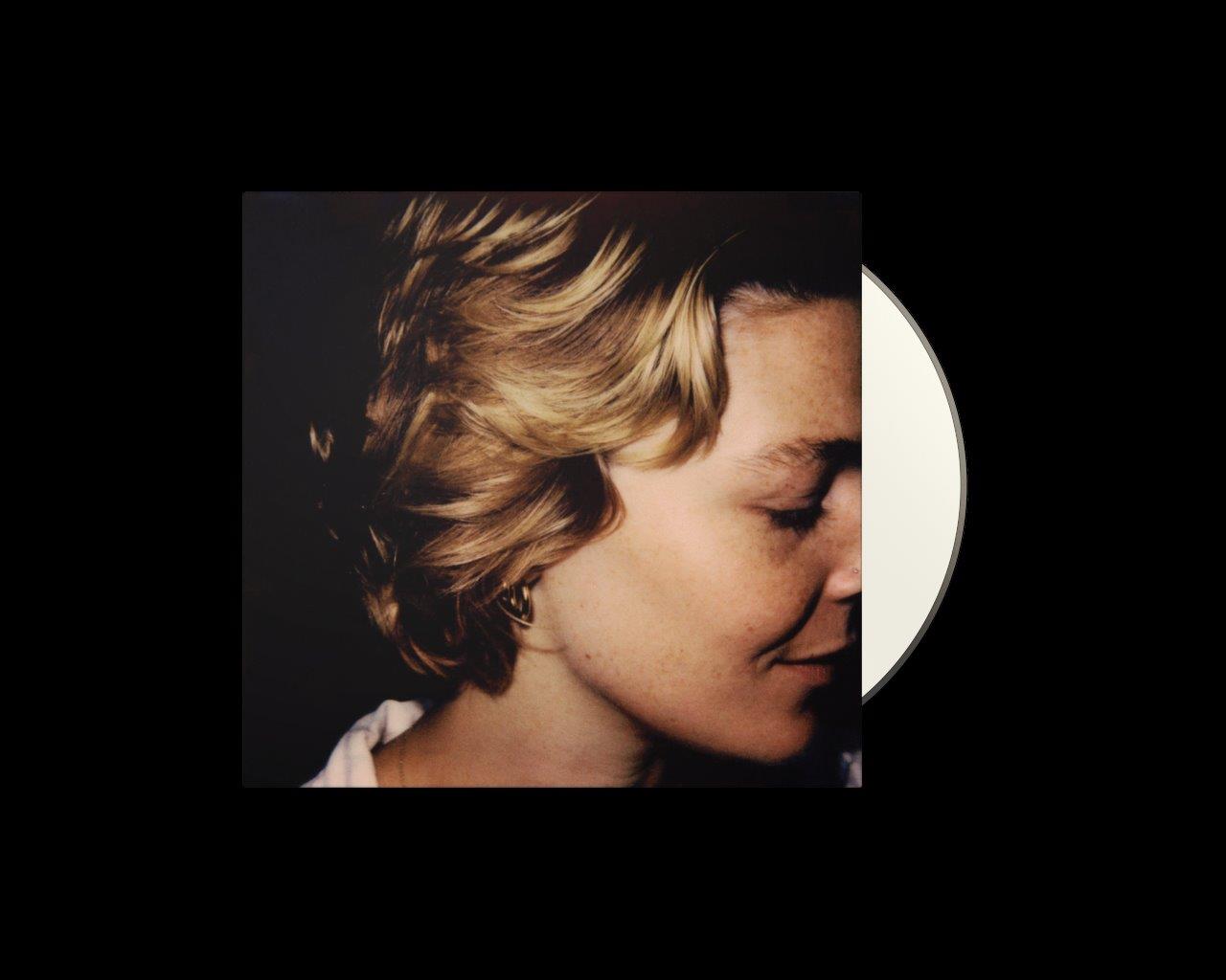 CD cover featuring a close-up portrait of Maggie Rogers with windblown hair.