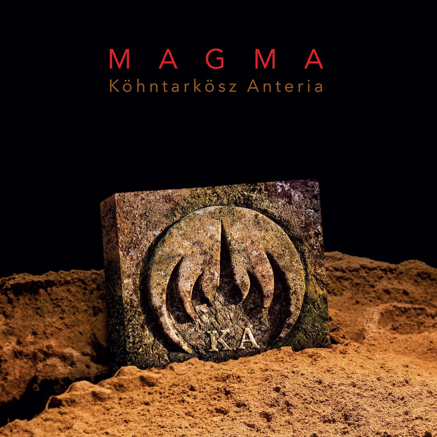 Magma album cover: stone block with carved spiral and “K.A” letters.